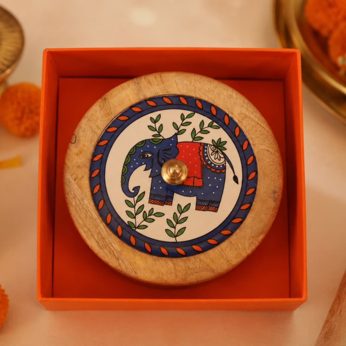 Both boxes side by side — the Gulmohar trellis lid and the Madhubani elephant lid
